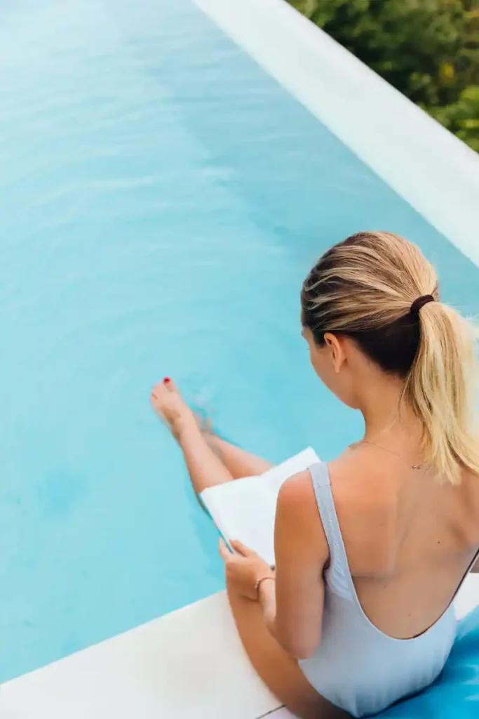 Woman at pool at The Oaks at Covell